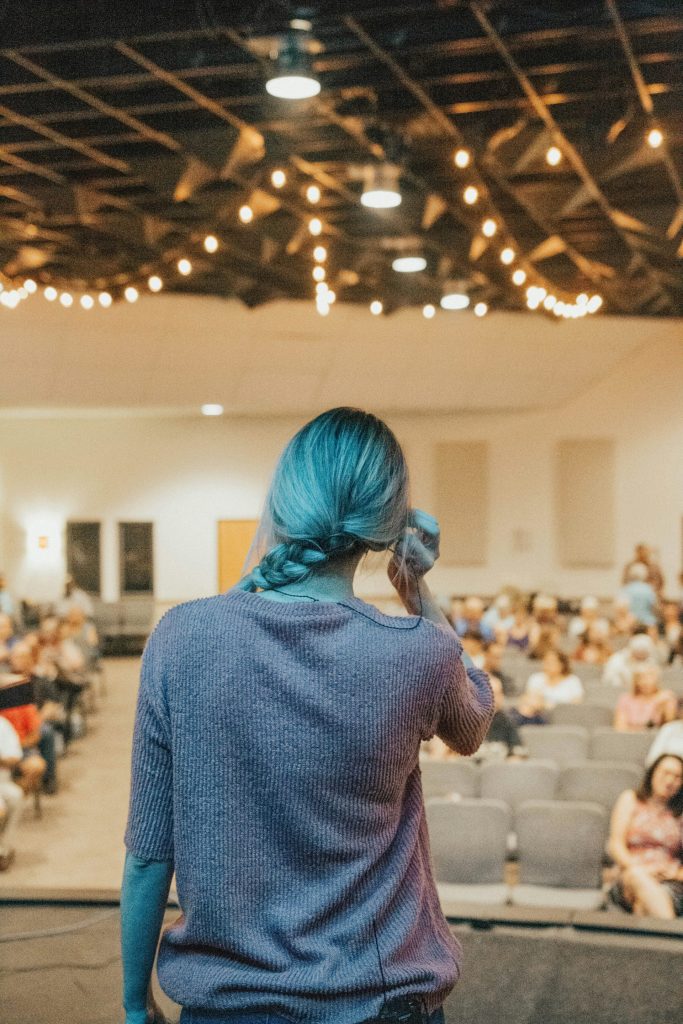 Person speaking to an audience